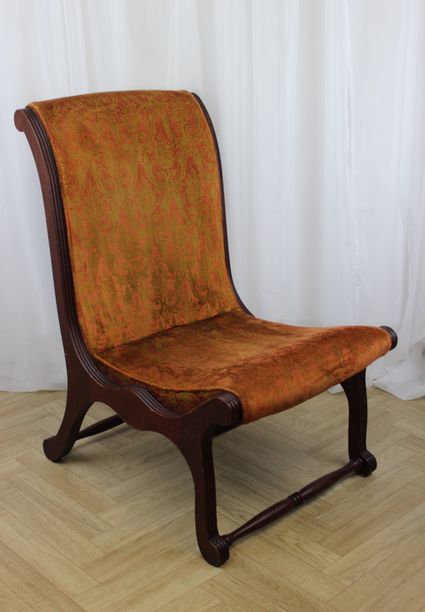 Antique Upholstered Slipper Chair with Ornate Design